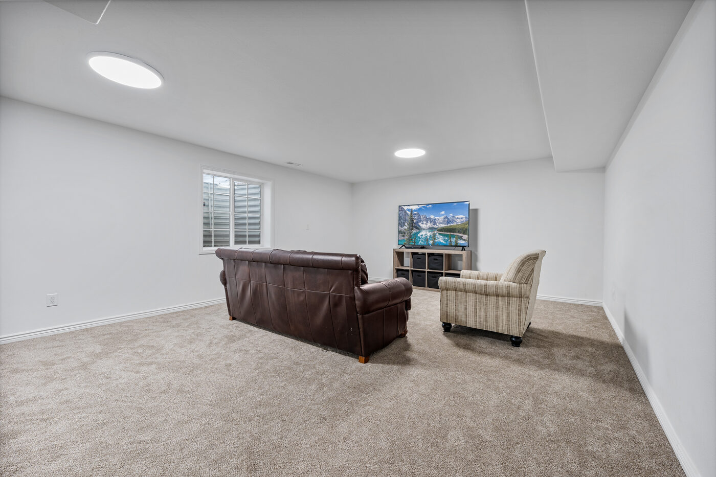 Finished basement family room with TV area — 625 Vale Lane Rexburg Idaho