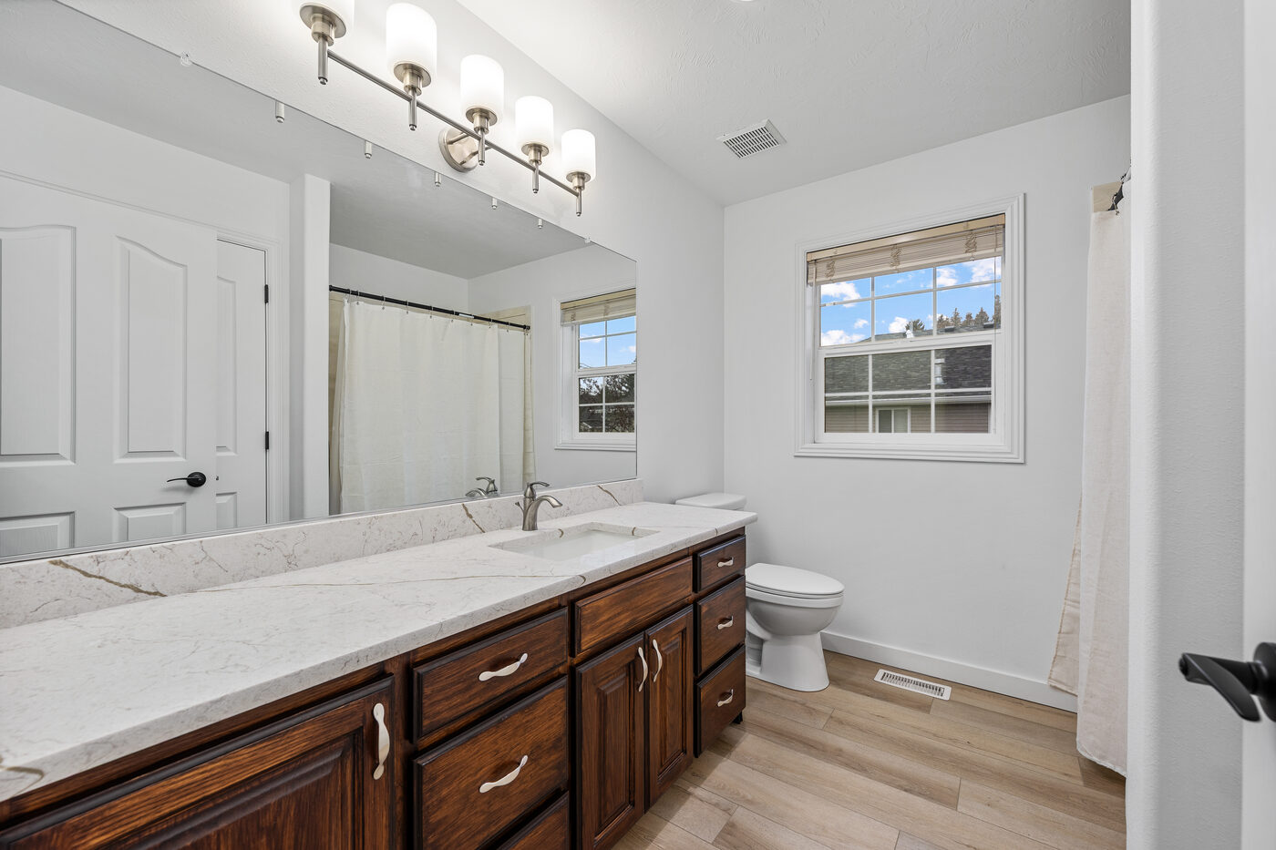Updated full bathroom with quartz vanity and new fixtures at 625 Vale Lane