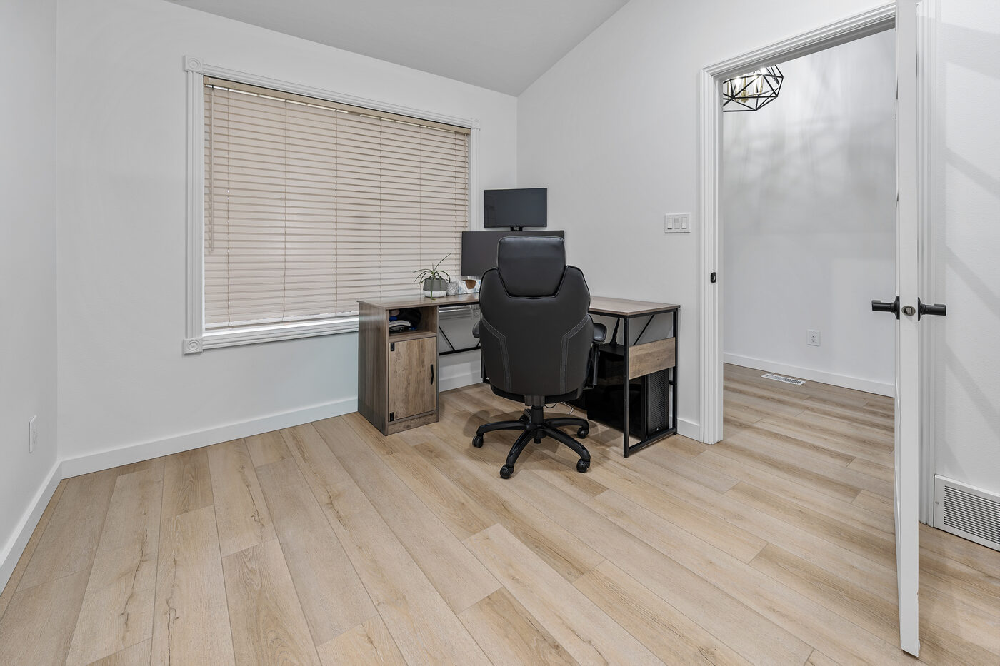 Dedicated home office with luxury vinyl flooring just off the entry